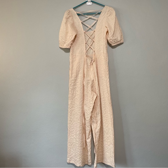 ASOS DESIGN Seersucker Lace Up Back Jumpsuit In Blush - Picture 3 of 14